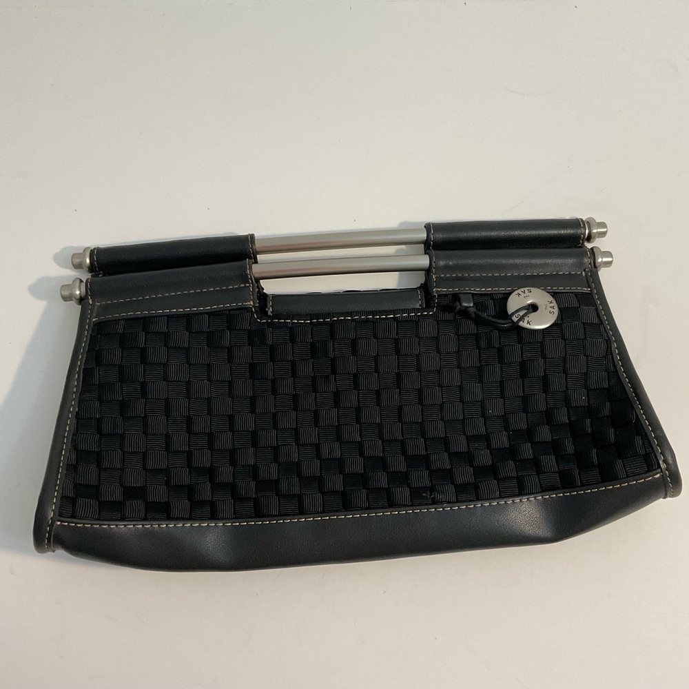 The Sak black woven clutch